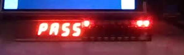 The 7-segment display showing PASS.